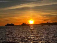 Thumbnail photo of sailboats on a river linkint to Sunset Sail photo page